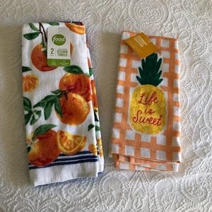 Two Sets of kitchen towels that have two in each set. New with tags. 100%cotton.